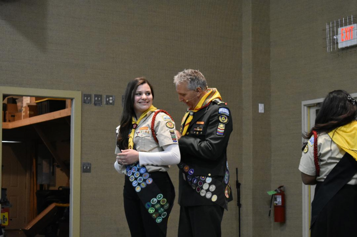 Shayley Hall receiving her Teen Leadership Training pin.